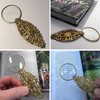 Gold Magnifying Glass with oval floral and leaf pattern, Handy