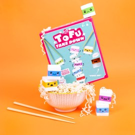Fizz Creations Tofu Take Down Fun Family Game. Funny Party Game Features 2 Pairs of Chopsticks, 10 Squishy Tofu Pieces, & 50 challenge cards. Ages 8+