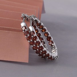 Femme Luxe created garnet gemstone Inside-Out hoop earrings in silver, January birthstone.