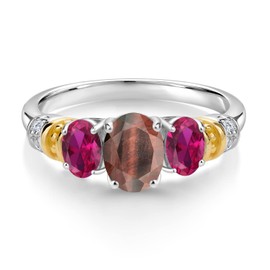 Gem Stone King 925 Sterling Silver and 10K Yellow Gold Oval Red Tiger Eye Red Created Ruby and White Diamond 3 Stone Ring For Women (2.28 Cttw, Gemstone Birthstone, Size 6)