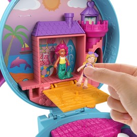 -​Polly Pocket Dolphin Beach Compact, Beach Adventure Theme with Micro Polly & Mermaid Doll, 5 Reveals & 13 Accessories