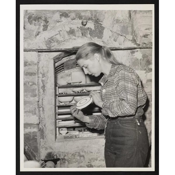 Unbranded Carol Janeway, cerarmist checks plate before putting in the