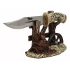 Western Horse Saddle By Wagon Wheel With Blunt Knife Display