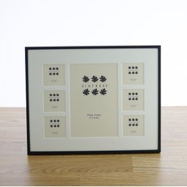 Sixtrees Park Lane 28537C(MIF) Black Seven Aperture Photo Frame With Mount. Six 2 x 2 inch and one 4 x 6 inch pictures. Complete with microfibre polishing cloth.