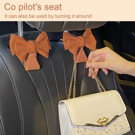 UOEPOWA 2 Pcs Car Back Seat Headrest Hooks, Elegant Stylish Leather Bow Car Hangers, Universal Rear Car Seat Storage Hook, Auto Interior Accessories for Handbag Purse Coat (Brown)