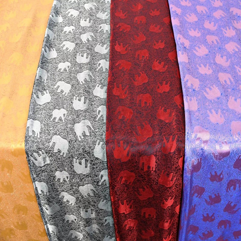 AeraVida Elegantly Stunning Hand Woven Red and Black Silk Elephant