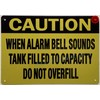 CAUTION WHEN ALARM BELL SOUNDS TANK FILLED TO CAPACITY DO