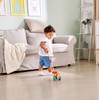 Hape - Uccellino Trainabile Spingi&Tira - Pappagallino in legno con