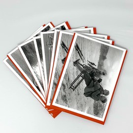 Pack of 8 Christmas cards featuring funny vintage black and white photos at Christmas, 2 each of 4 different designs, cards are 12.5 x 17.5cm and come with a red envelope