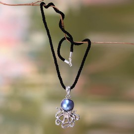 NOVICA Artisan Crafted Sterling Silver Cultured Freshwater Pearl Pendant Necklace | Silk Cord Dyed Blue Birthstone | Animal Themed | Lobster Clasp | Indonesia 'Blue Octopus' 2.3" L x 1.4" W x 0.5" D