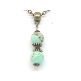 Women's necklace with pendant in reconstituted turquoise beads dyed in blue and Tibetan beads in antique bronze