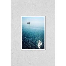 Poster Reproduction of Morning sea with boat on the horizon. Aged photo. Sailing ship profile. Toned image. Sunbeams on the sea surface. Calm Sea with a Sailing Vessel. Cirali, Antalya Province