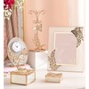 A Sophia® Classic Gold Butterfly Photo Frame 5” x 7”.