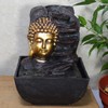 Golden Buddha Head Aside Rocks Water Fountain With Light Perfect
