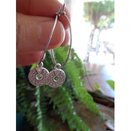 Delicate stainless steel hoop earrings with perforated Miao Thai disc. Anti-allergic ethnic tribal earrings