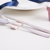 Pristine pastel-colored premium quality domestic cutlery set with good grip,