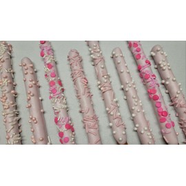 Gender Reveal Pink Chocolate Pretzel Rods with Pink Sprinkles and assorted toppings