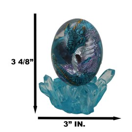 Ebros Gift Fantasy Land of The Dragons Small Fossil Dragon Hatchling Sleeping in Crystal Acrylic Glass Egg with Colorful LED Night Light Magma Lava Rock Base and Blue Crystals Base (Blue)