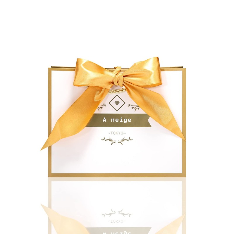 A neige Gift Bag with Gold Ribbon