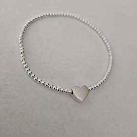 Rosario García. Pulsera corazón central con cuentas de plata certificada.