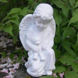 Little Angel with Consolation Teddy Holding in Arms.