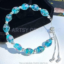 ARTSY CRAFTS INC Oval Shaped Glow in the Dark Firefly Bead Bracelets, Butterfly Charm Rose Flower Beaded Bracelet Luminous Murano Jewelry, Gifts for Birthday Valentines (Blue/Slider)