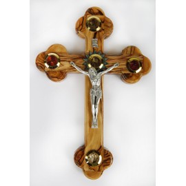 Olive Wood Crucifix/Wall Cross adorned with olive leaves,frankincense,flowers and stones from Jerusalem. Hand Crafted in Bethlehem.Ideal Religious Gift for Christmas or any other Christian Holiday.