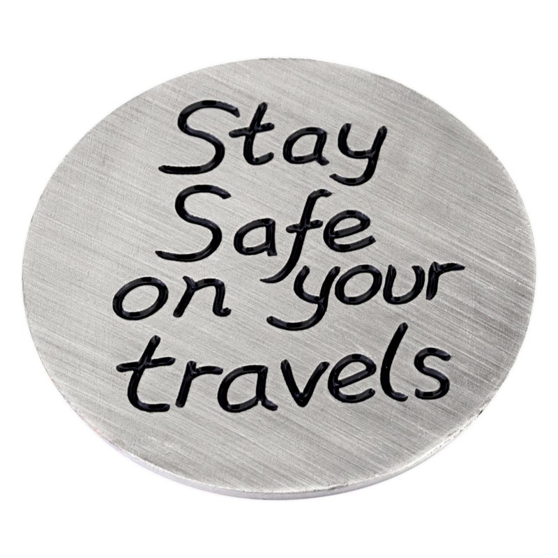 Compass travel token with 'Stay safe on your travels' message