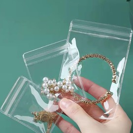 GSHLLO 100 Pcs Clear Small Plastic Bags Jewelry Ziplock Bags Bracelets Rings Storage Pouch Portable Earrings Bags Self Sealing Necklace Bags for Pill Beads 6 x 8 cm