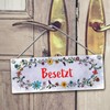 Grey toilet is free or occupied reversible sign with flower