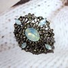 Antique Gold Tone Geometric Foliate Filigree Art Deco Blue Oval