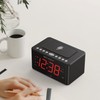 Emerson CKSW0555 Smartset Wireless Charging Alarm Clock Radio Featuring a