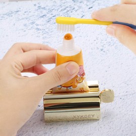 XYKEEY Toothpaste Tube Squeezer - Set of 2 Toothpaste Squeezer Rollers, Metal Toothpaste Tube Wringer Seat Holder Stand (Gold)