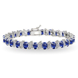 B. BRILLIANT Sterling Silver Created Blue Sapphire 6x4mm Oval and S Tennis Bracelet with White Topaz Accents