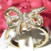 YourJewelleryBox TK1108PB Stainless Steel 18KT Gold Bow Ring Simulated Diamonds