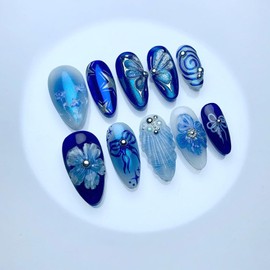 24Pcs Blue Flower Press on Nails Medium Almond Fake Nails with Sea Butterfly Pearl Shell Pattern Blue Deep Glossy Full Cover Artificial Glue on Nails Handmade Stick on False Nails for Women