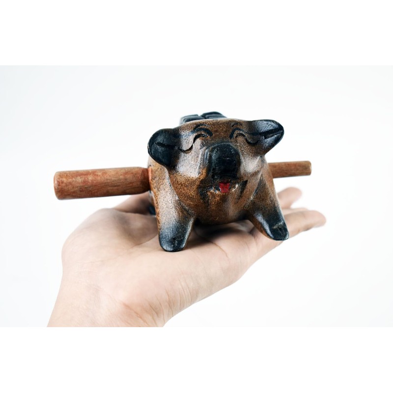 Guiro music percussion instruments wooden sound block animal croaking Pig