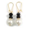 Stylish Black/White Glass Bead Drop Earrings With Gold Tone Bean
