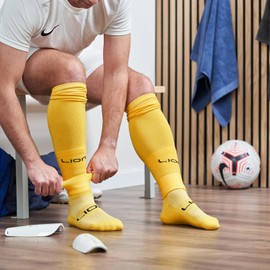 LION SPORTSWEAR Football Sock Sleeves To Accompany Grip Socks - Fits Over Calf/Shin Pads - Variety Of Colors To Match Your Team Kit (Amber, One Size)