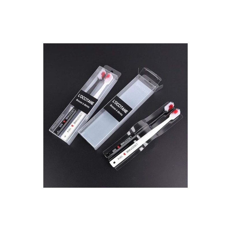 2 cepillos de dientes blancos y negros en forma de