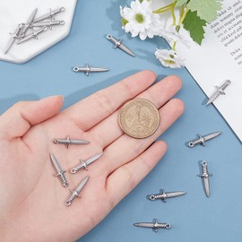 UNICRAFTALE about 16pcs Dagger Shape Charm Stainless Steel Charm Metal Charms Pendant Hypoallergenic Metal Pendant for DIY Jewelry Making 24mm,1.6mm Hole Stainless Steel Color, 24mm long, Stainless Steel