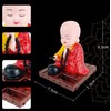 EatingBiting Little Monk Figurine Solar Buddha Monk Shaking Head Statue