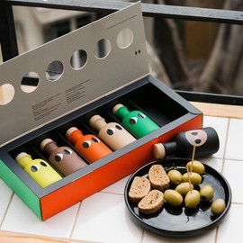 Yiayia and Friends Yiayia and Friends Gift Box of Assorted Mini Greek Extra Virgin Olive Oils: tangy lemon, earthy truffle, spicy chili, refreshing basil, pungent garlic, and original.