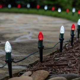 Wintergreen Lighting 50’ OptiCore LED C7 Red and White Pathway Christmas Lights, C7 Candy Cane Outdoor Christmas Lights, 4.5” Stakes, Green Wire Plug String Lights
