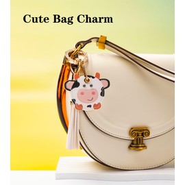 YOU WIZV Cute Airtag Keychain, Off White Leather Anime Cow Keychain Bag Charm with Tassel Keychains Accessories, Cute Backpack Keychains for Women,Girls,Boys