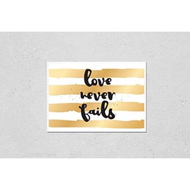 Poster Reproduction of Love never fails romantic inspirational inscription. Greeting card with calligraphy. Hand drawn lettering design. Photo overlay. Typography for banner, poster or apparel