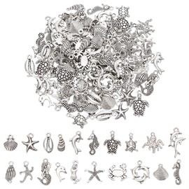 UNICRAFTALE 100Pcs 20 Styles Assorted Ocean Charms Set Seashells Starfish Conch Dolphin Pendant Set Tibetan Style Pendants Antique Silver Ocean Life Seafish Charms for DIY Jewelry Making