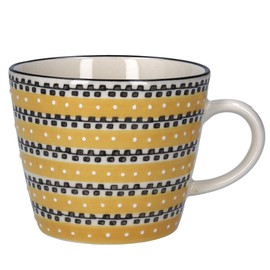 Keramiktasse mit senffarbenen Spuren