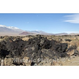 California Photo - Lava Rock Formation with Mountains in Distance Along U.S. Highway 395, North of Independence, California, in The Broad Owens Valley west of Death Valley - 24in x 16in