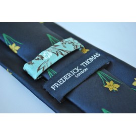 Frederick Thomas navy blue tie with daffodil design with signature floral design to the rear